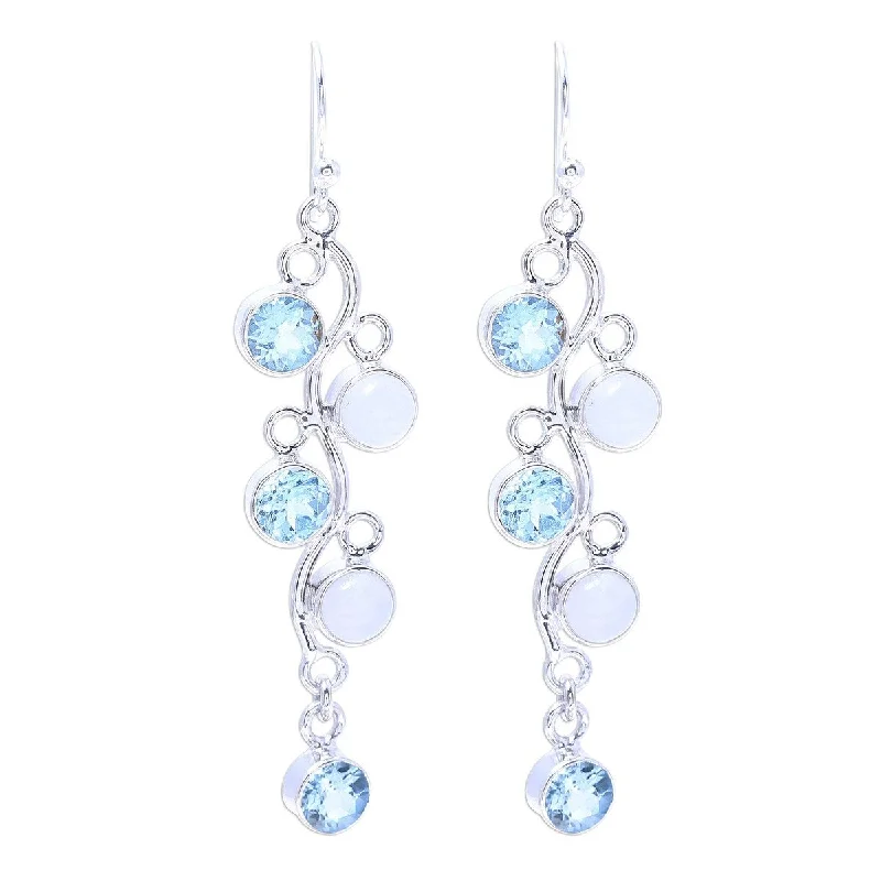 NOVICA Morning Climber, Blue topaz and rainbow moonstone dangle earrings - 2.4L*0.5W